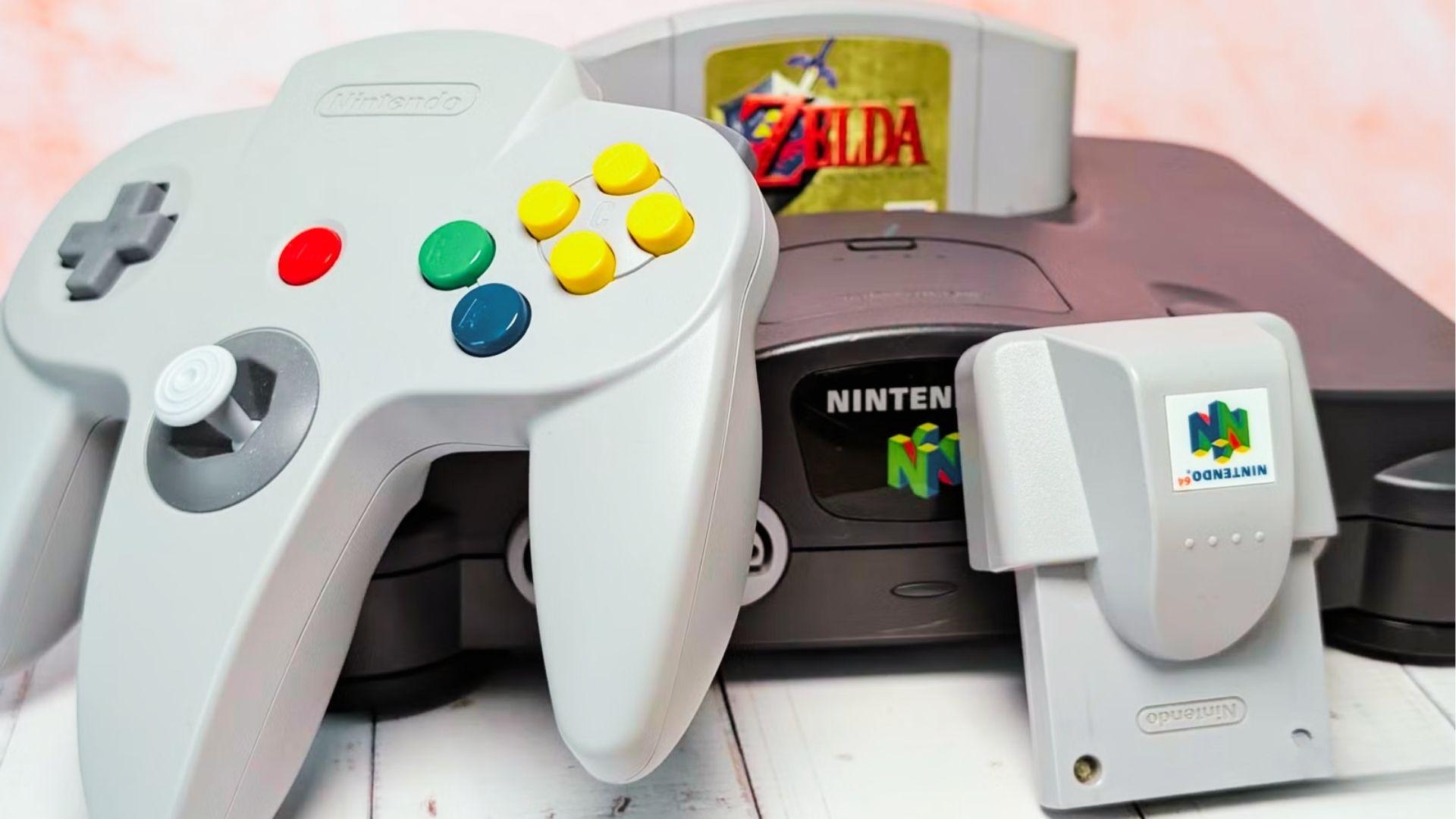 Original grey Nintendo 64 console with Zelda Ocarina of Time cartridge, grey controller, and grey Rumble Pak accessory shown