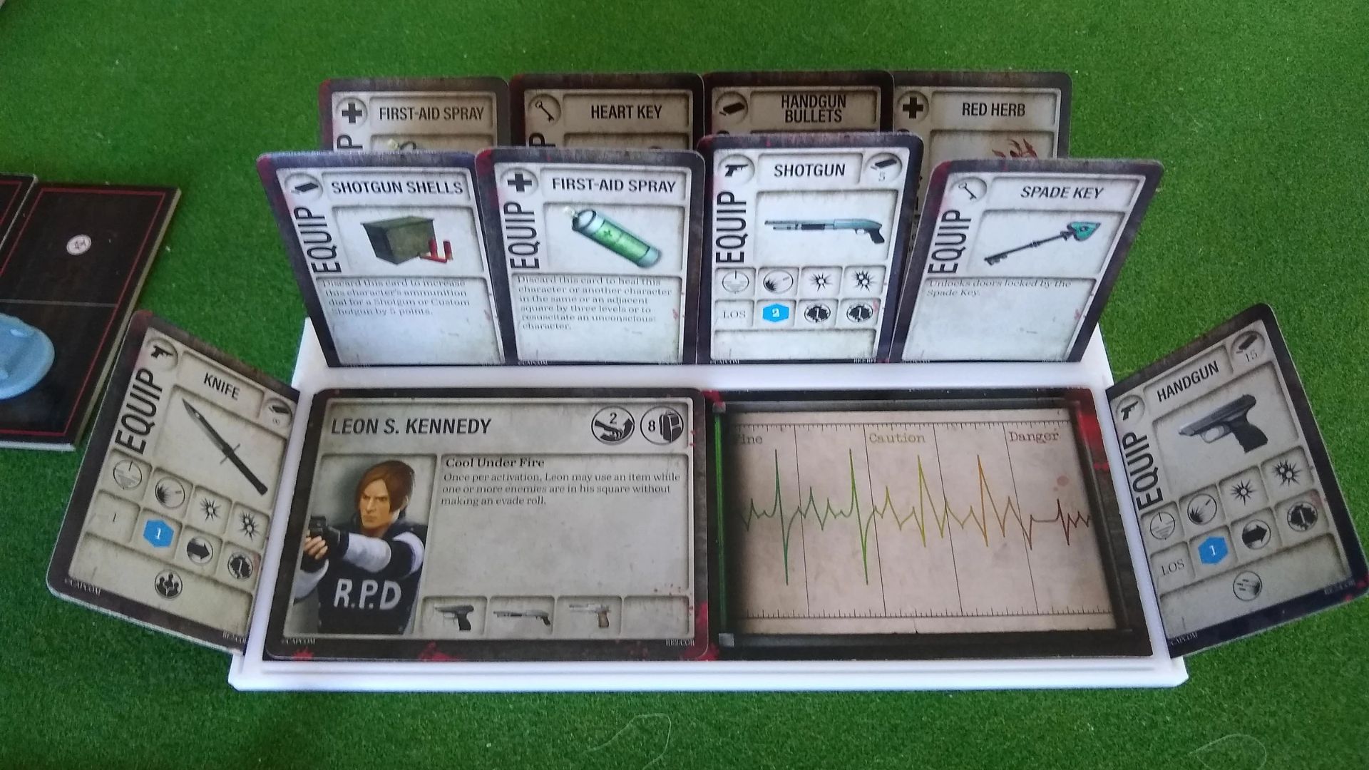 Leon S. Kennedy dashboard with health tracker, shotgun, first-aid spray, and keys in player setup.
