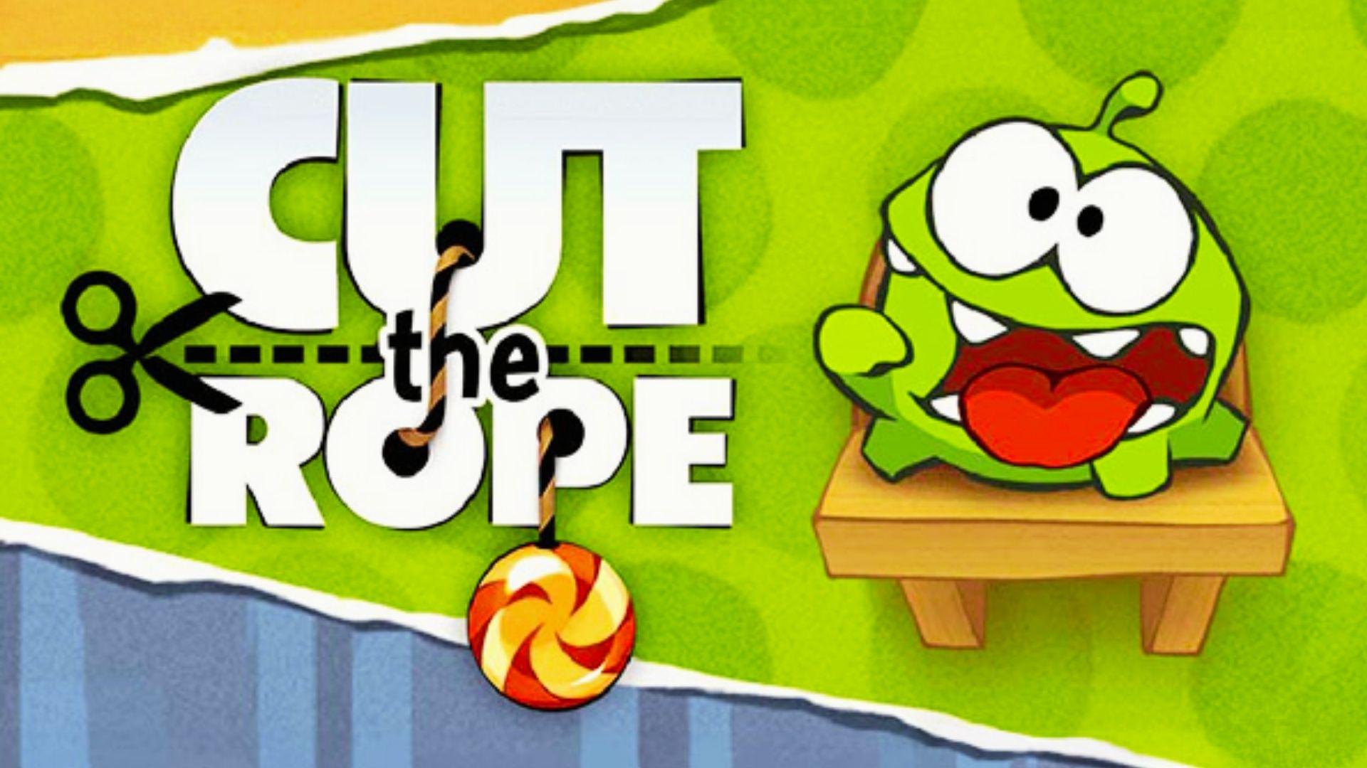 Cut the Rope logo with scissors cutting dashed line, candy dangling, Om Nom on box, green background, excited