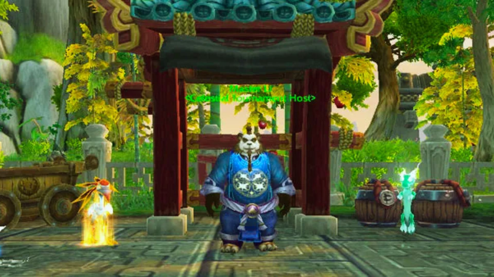 "World of Warcraft close-up of pandaren Master Li under a red pagoda, flanked by fire-crane pet Chi-Chi and green dragon pet Yu'la.”