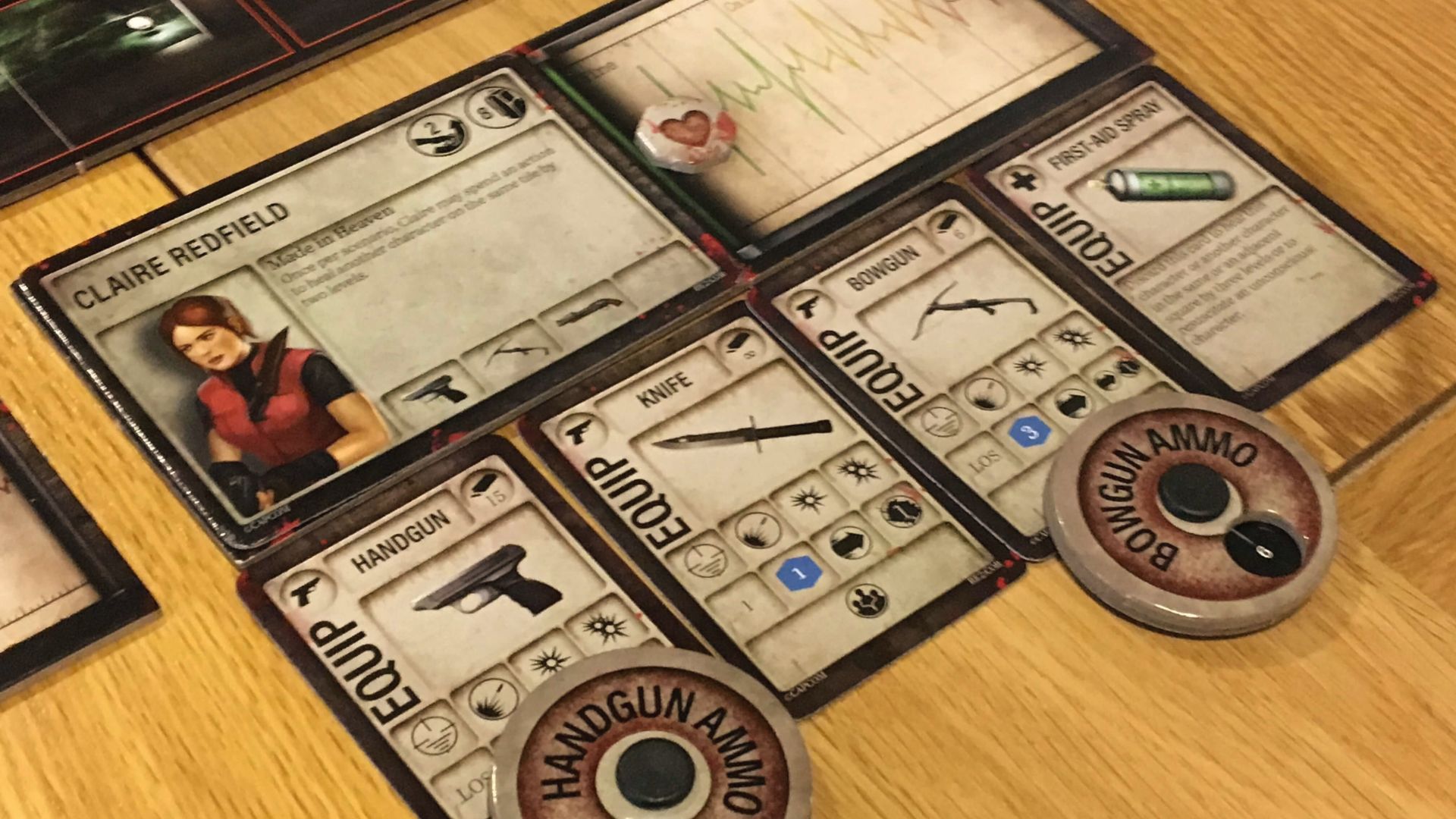 Claire Redfield character board equipped with handgun, knife, bowgun, and ammo dials ready for action.