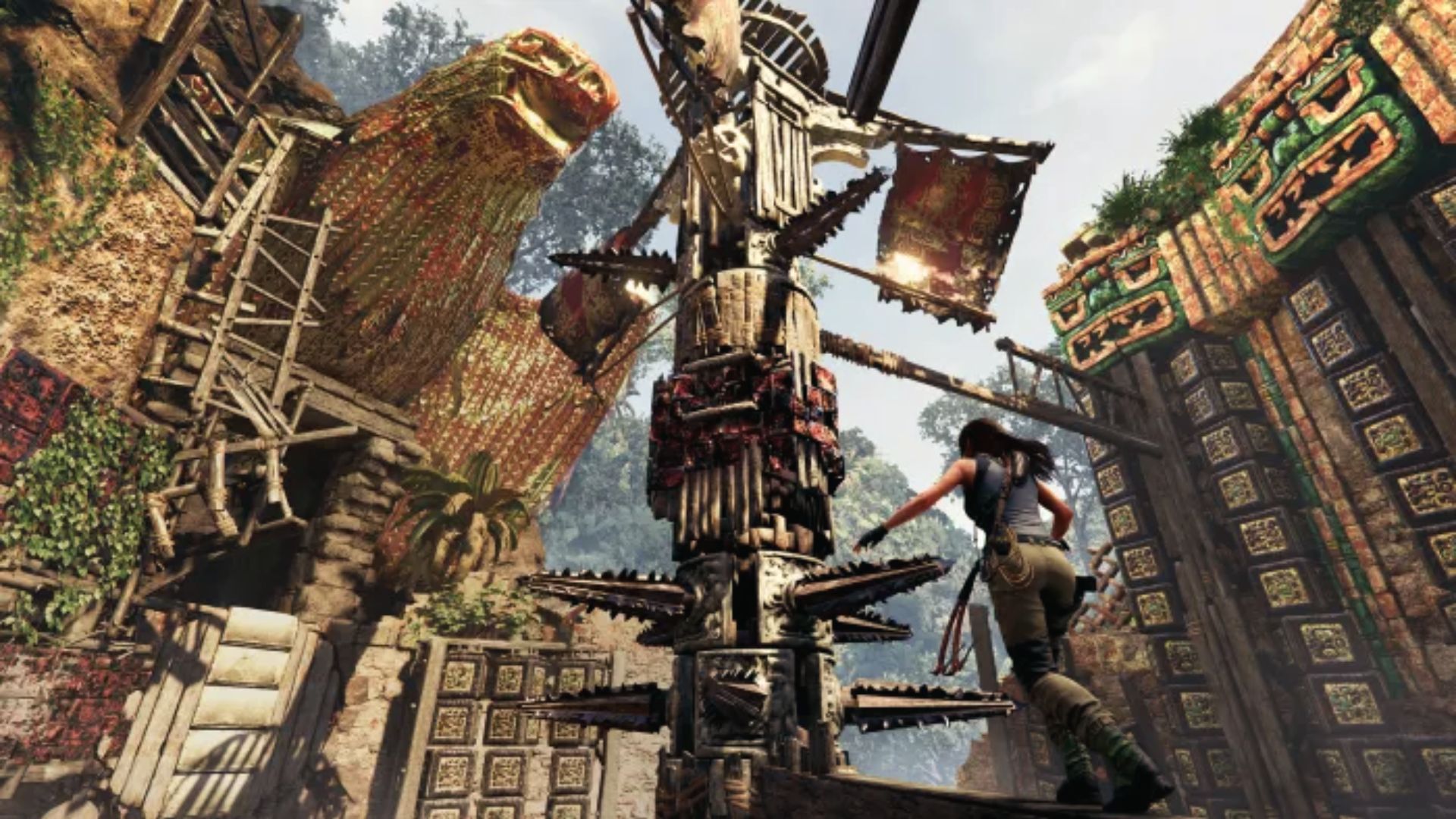 Lara approaches a spiked wooden trap in sunlit ruins. Rise of the Tomb Raider blends puzzles with danger.